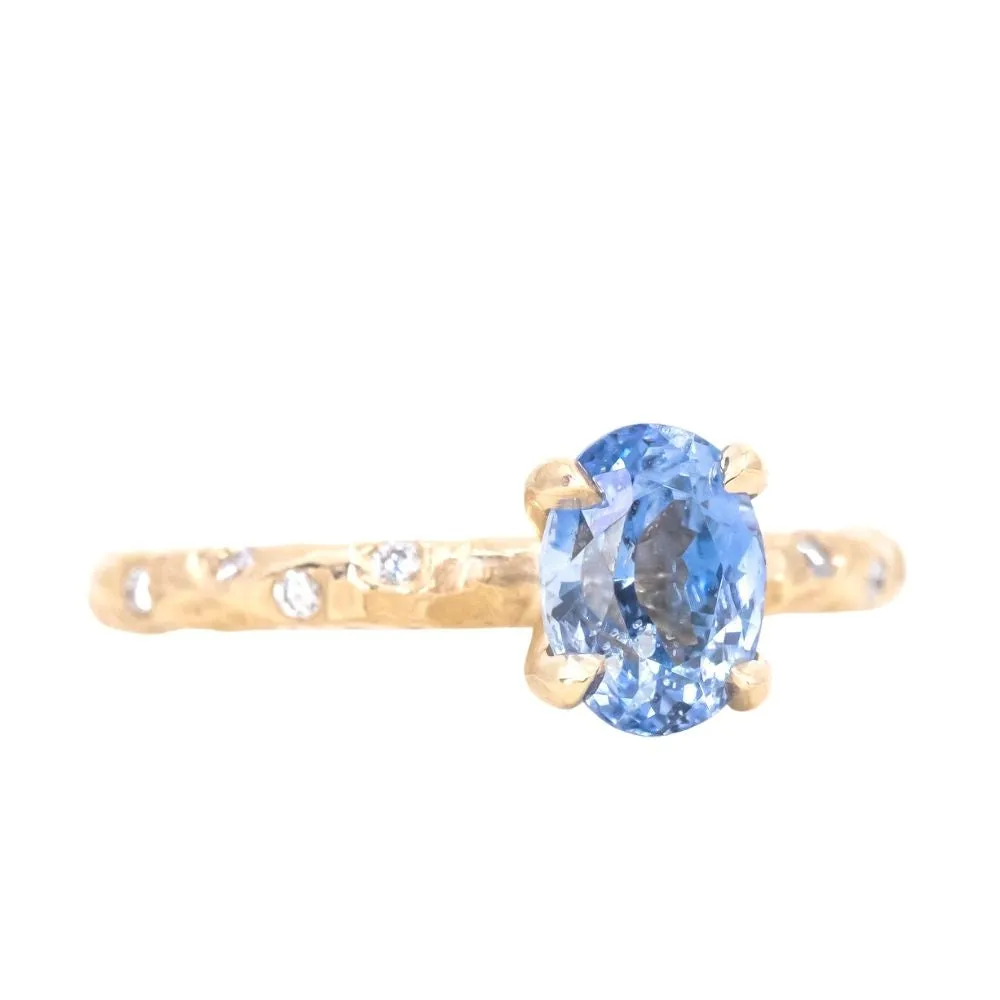 1.52ct Oval Blue Sapphire in 14k Yellow Gold Evergreen Solitaire with Scattered Embedded Diamonds