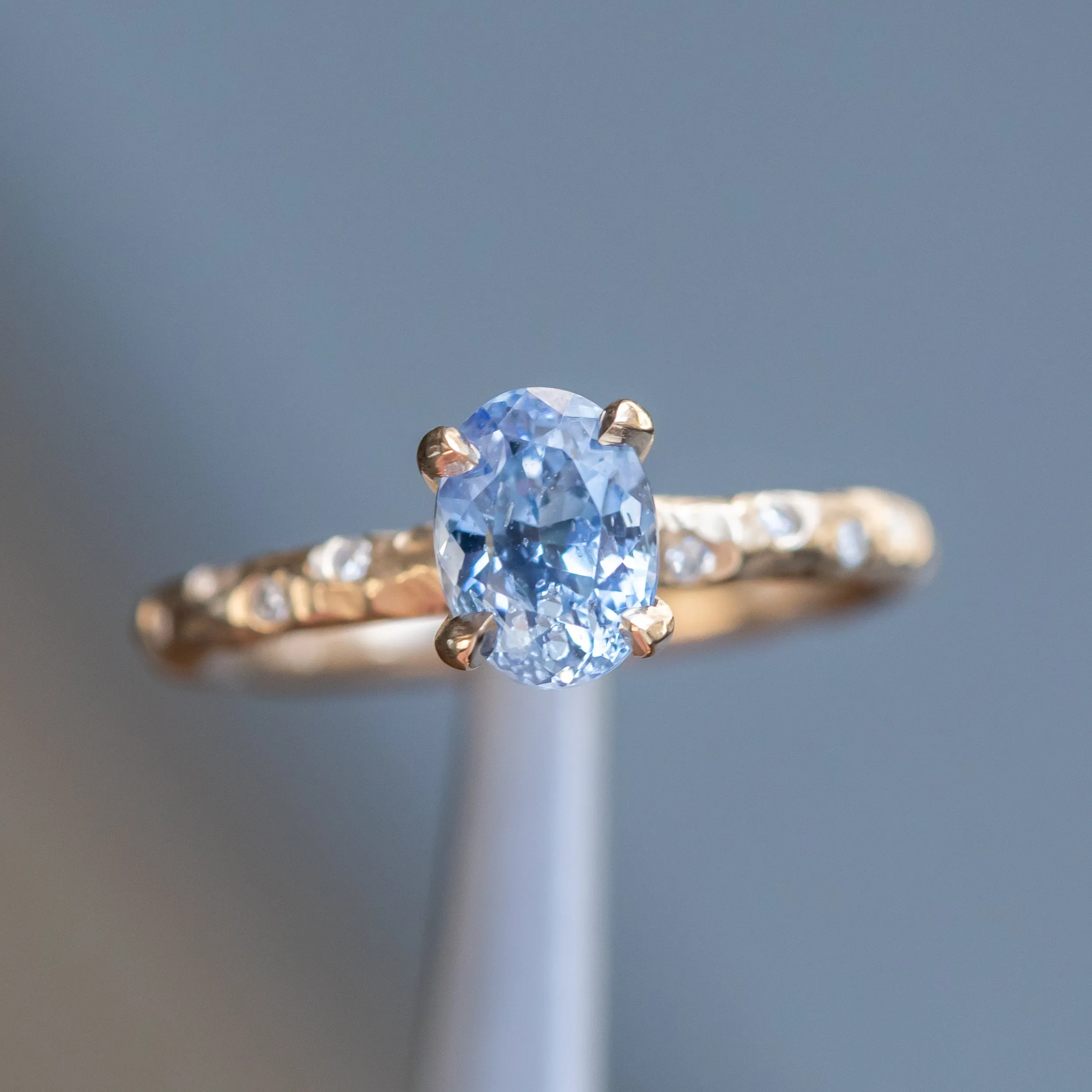 1.52ct Oval Blue Sapphire in 14k Yellow Gold Evergreen Solitaire with Scattered Embedded Diamonds