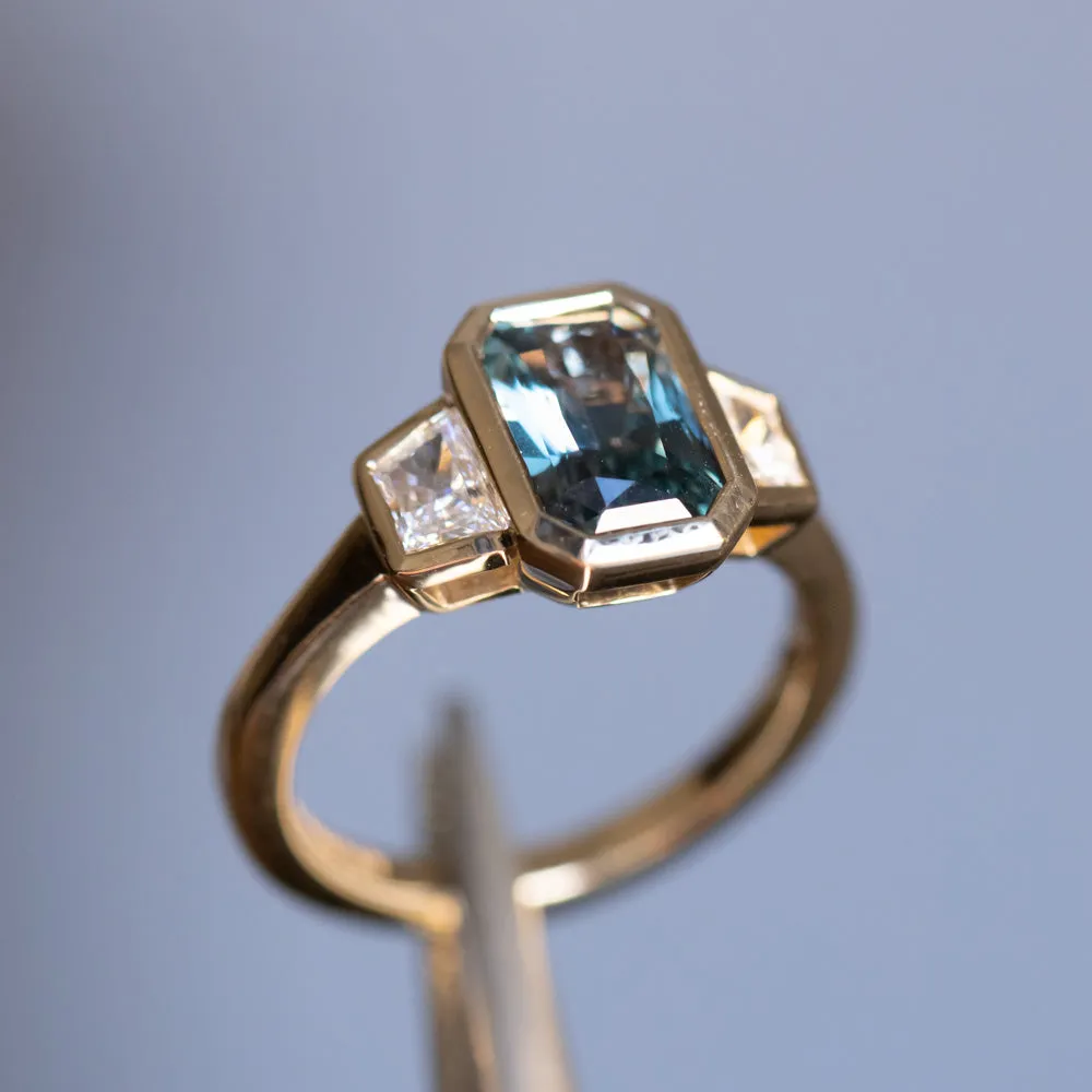 2.02ct Untreated Radiant Cut Color Shifting Sapphire and White Diamond Three Stone Bezel Set Ring in 14k Yellow Gold