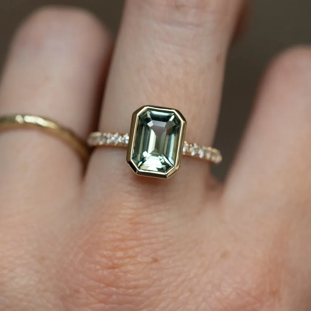 3.02ct Emerald Cut Madagascar Minty Sapphire Low Profile Bezel Solitaire Ring with French Set Diamonds in 14k Yellow Gold