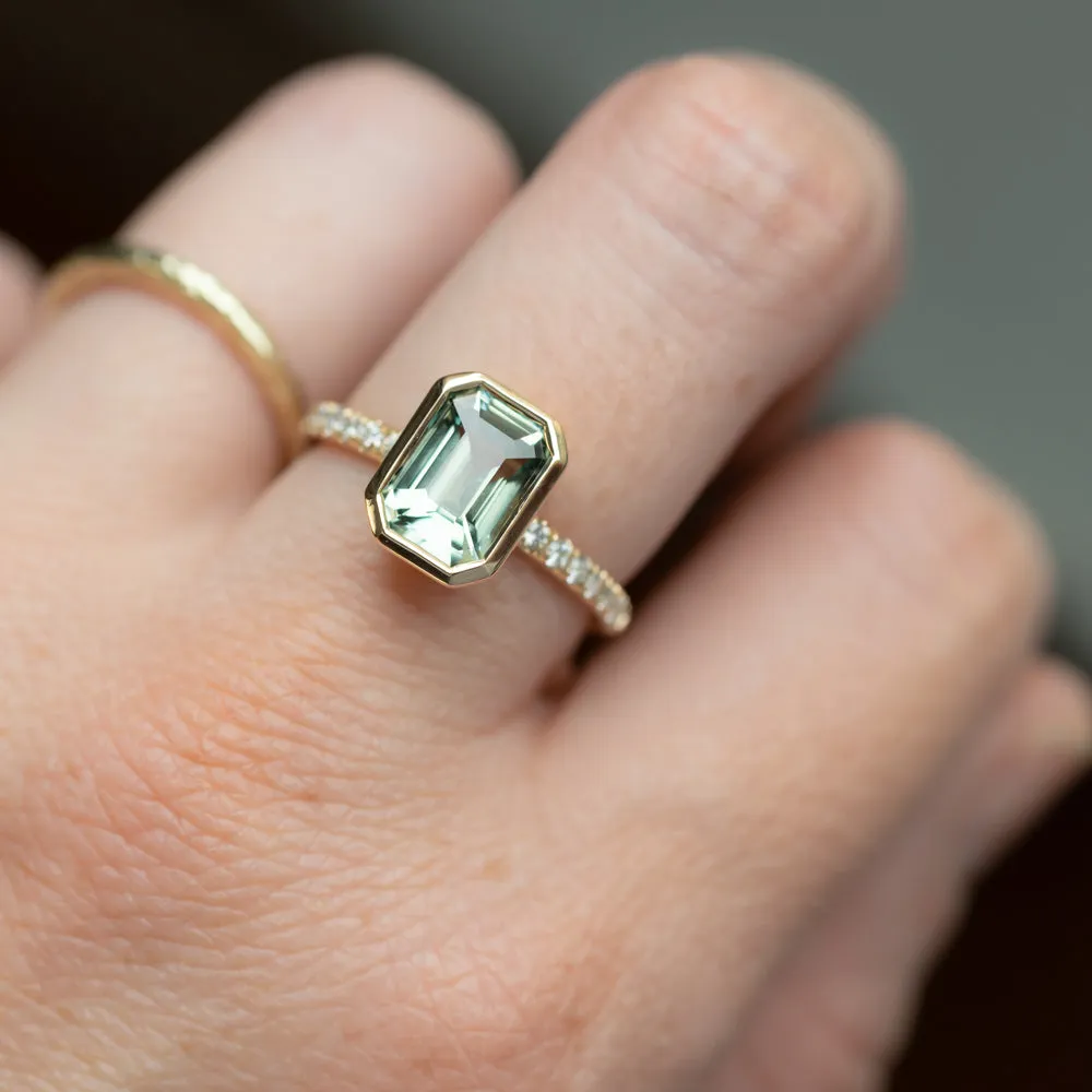 3.02ct Emerald Cut Madagascar Minty Sapphire Low Profile Bezel Solitaire Ring with French Set Diamonds in 14k Yellow Gold