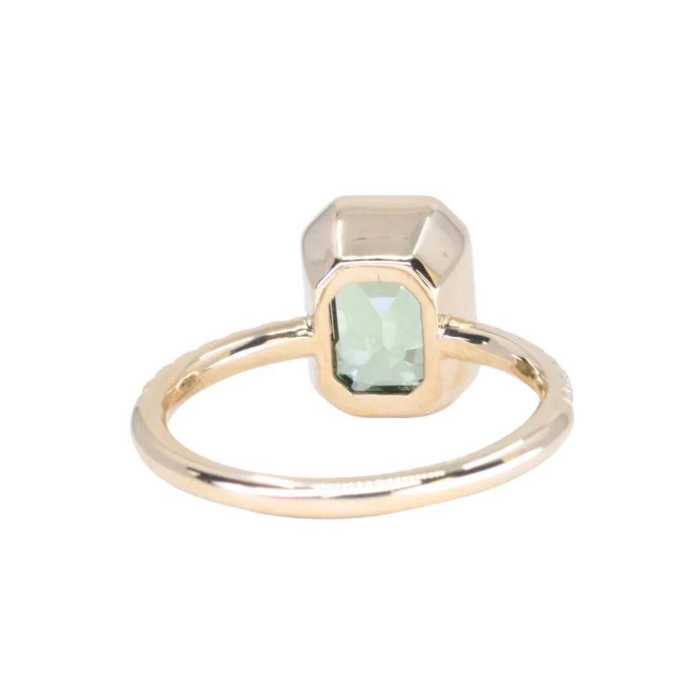 3.02ct Emerald Cut Madagascar Minty Sapphire Low Profile Bezel Solitaire Ring with French Set Diamonds in 14k Yellow Gold