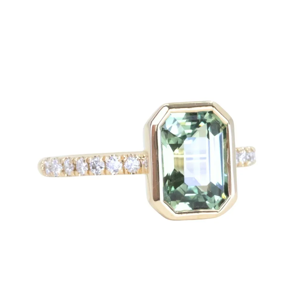 3.02ct Emerald Cut Madagascar Minty Sapphire Low Profile Bezel Solitaire Ring with French Set Diamonds in 14k Yellow Gold