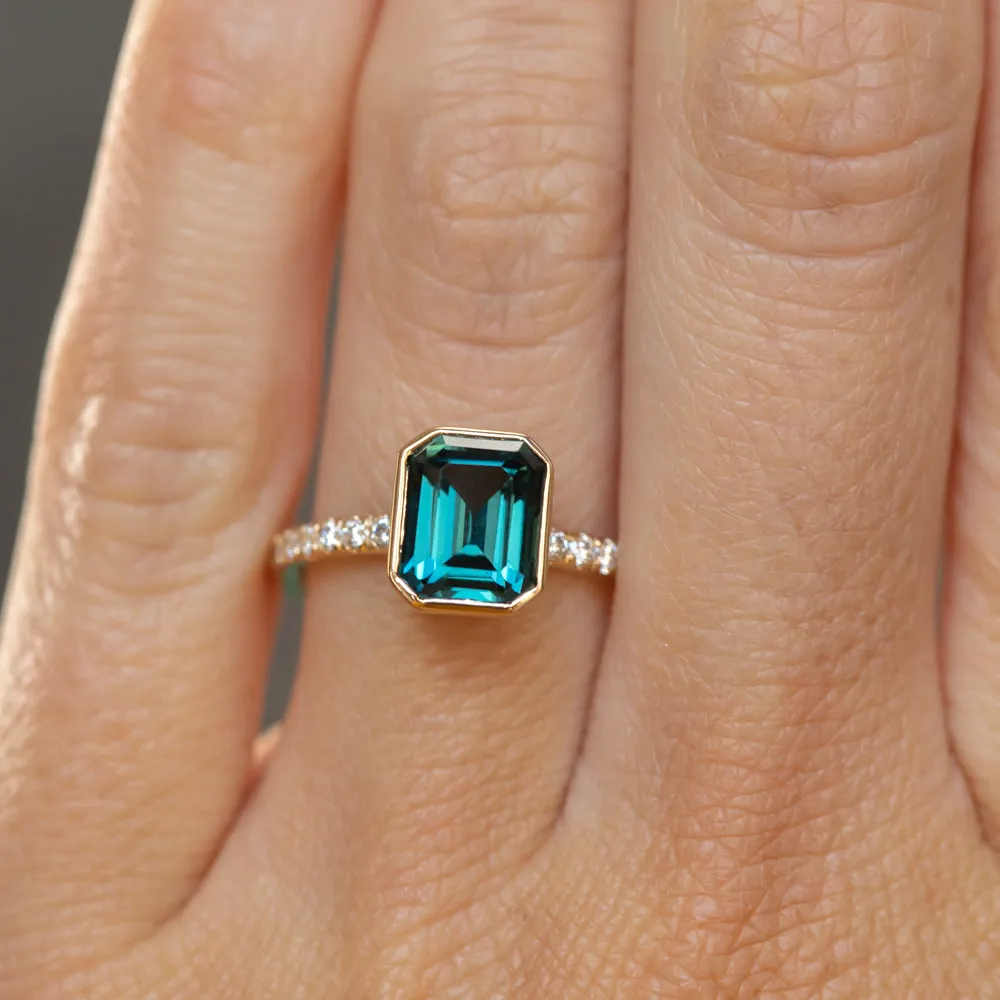 3.05ct Emerald Cut Color Shifting Teal Blue Green Sapphire Low Profile Bezel with French Set Diamonds 18k Yellow