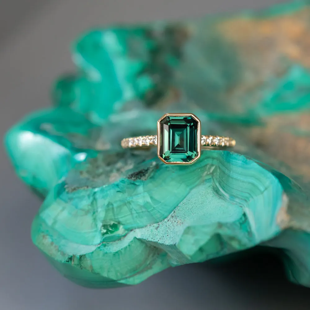 3.05ct Emerald Cut Color Shifting Teal Blue Green Sapphire Low Profile Bezel with French Set Diamonds 18k Yellow