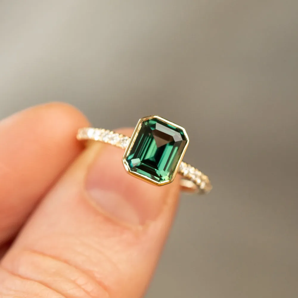 3.05ct Emerald Cut Color Shifting Teal Blue Green Sapphire Low Profile Bezel with French Set Diamonds 18k Yellow