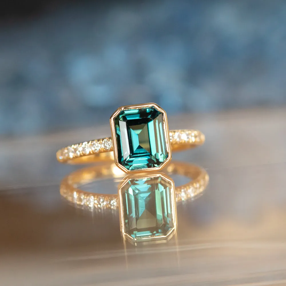 3.05ct Emerald Cut Color Shifting Teal Blue Green Sapphire Low Profile Bezel with French Set Diamonds 18k Yellow