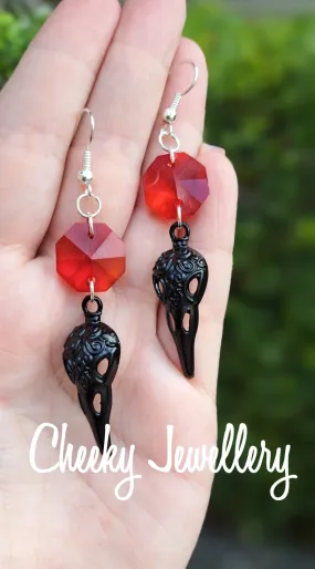 Bird skull earrings in black with Ruby red crystal, Stainless steel earring hooks
Halloween earrings these are just too perfect