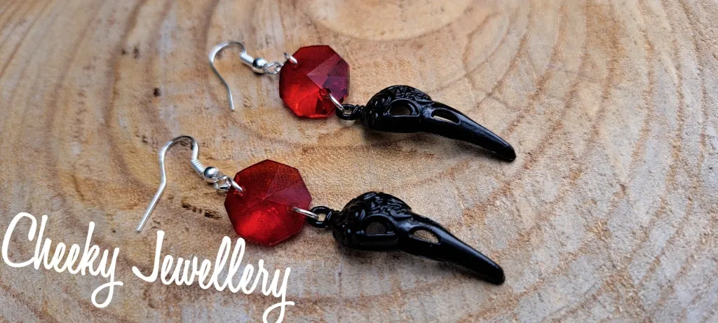 Bird skull earrings in black with Ruby red crystal, Stainless steel earring hooks
Halloween earrings these are just too perfect