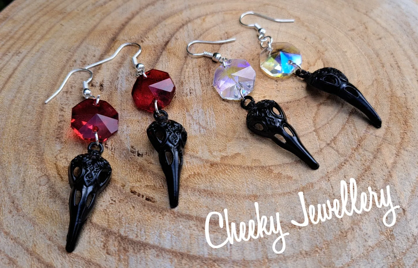 Bird skull earrings in black with Ruby red crystal, Stainless steel earring hooks
Halloween earrings these are just too perfect